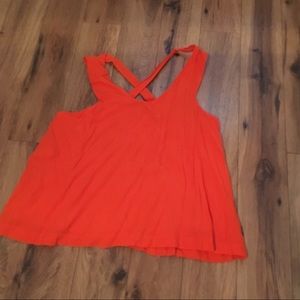 Bright orange blouse with cross cross straps